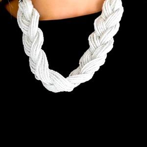 White braided sea bead necklace.